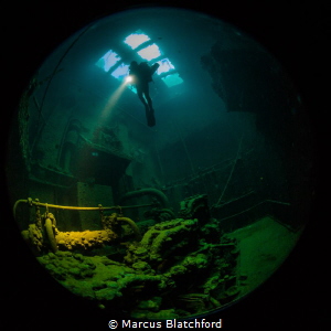 Diver inside the engine room of Kensho Maru by Marcus Blatchford 